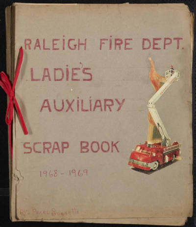 Cover page of Raleigh Fire Department women's group scrapbook, features a firetruck illustration