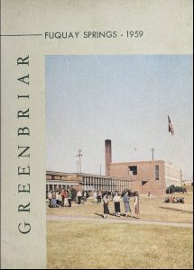 Cover of the Fuquay Springs High School yearbook showing women standing outside the school