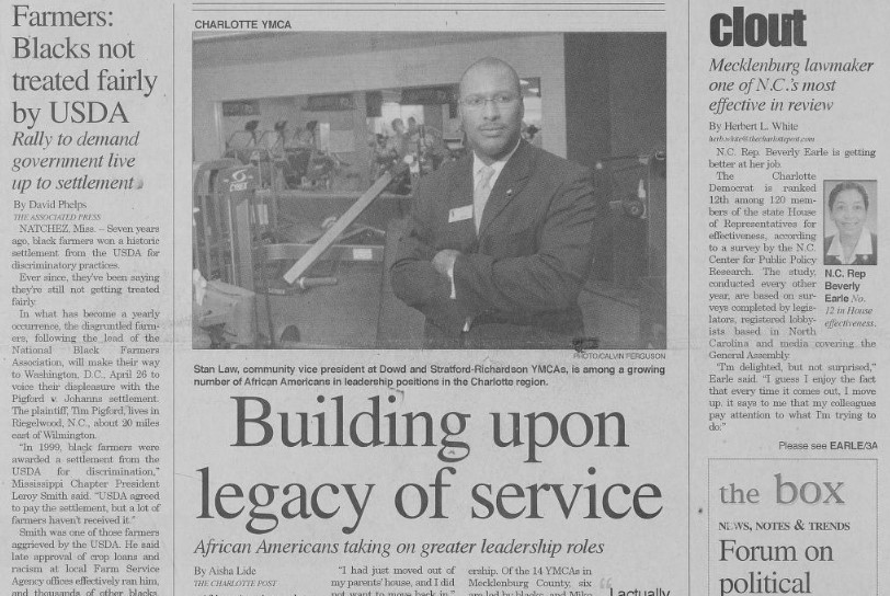 A section of front page articles, including a photo of Stan Law, community vice president at Dowd and Stratford-Richardson YMCAs.
