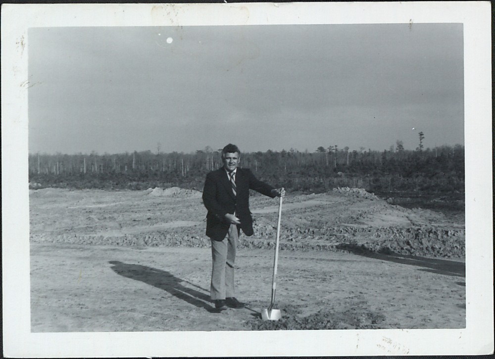 President of Pamlico Technical Institute, now Pamlico Community College, Paul Johnson wields a shovel at the groundbreaking for the college's permanent location.
