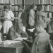 Library Scene African-American High School Age Students Reading Standing or Seated