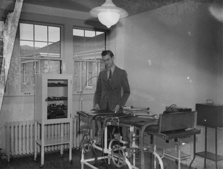 Black and white photograph of a person inside the Ashe hospital