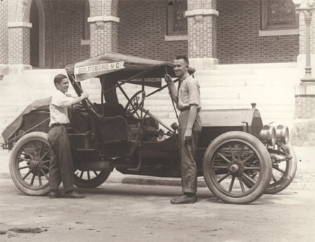 Image of George M. Norwood and William B. Thompson with striped 1912 Cadillac