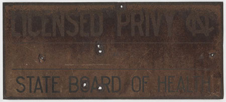 Image of a sign acknowledging a licensed privy