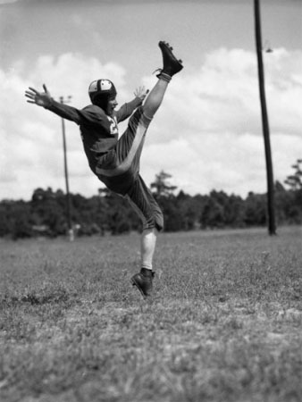 Image of a football player kicking