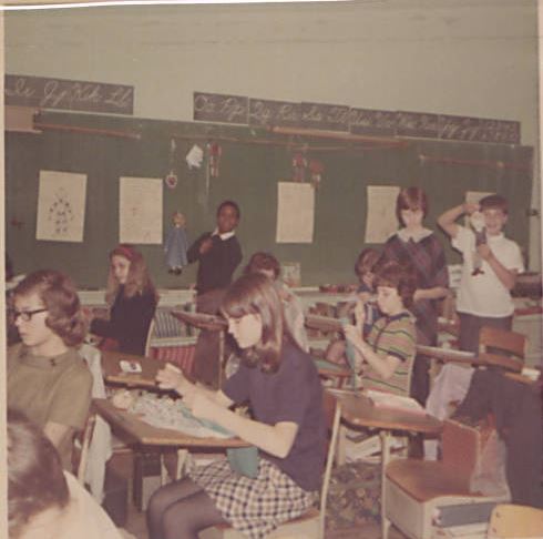 Sixth graders create puppets in Helen Poole's class. January 1968