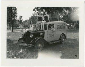 Girls at pool sitting on the Coca-Cola truck