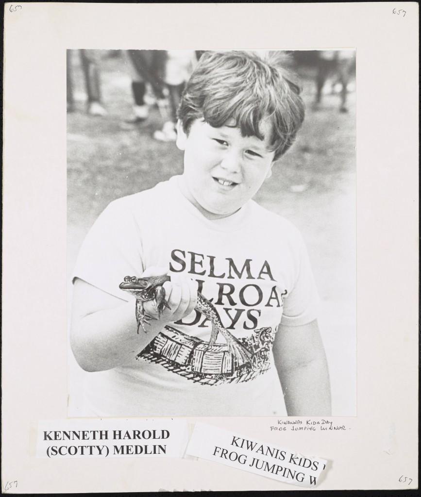 Boy holding frog