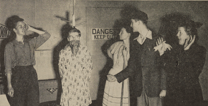 The high school cast of the play "Spring Fever" acting out a scene.