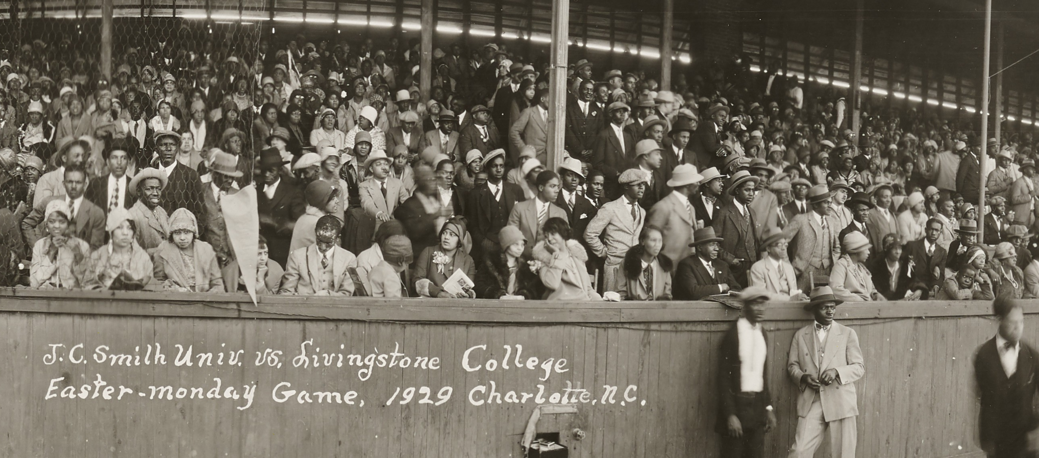 Close up of the crowd in the stands watching a baseball game.