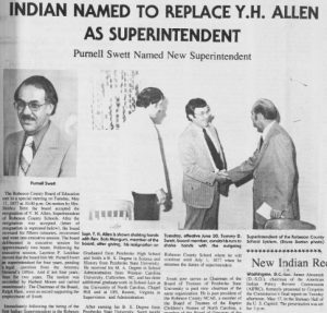 Clipping of a front page article. The title is "Indian Named to Replace Y.H. Allen as Superintendent". There is a headshot of new superintendent Purnell Swett and a photo of two adults shaking hands while another adult stands to the left.