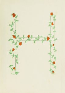 Letter "H" created out of flowers and cines.