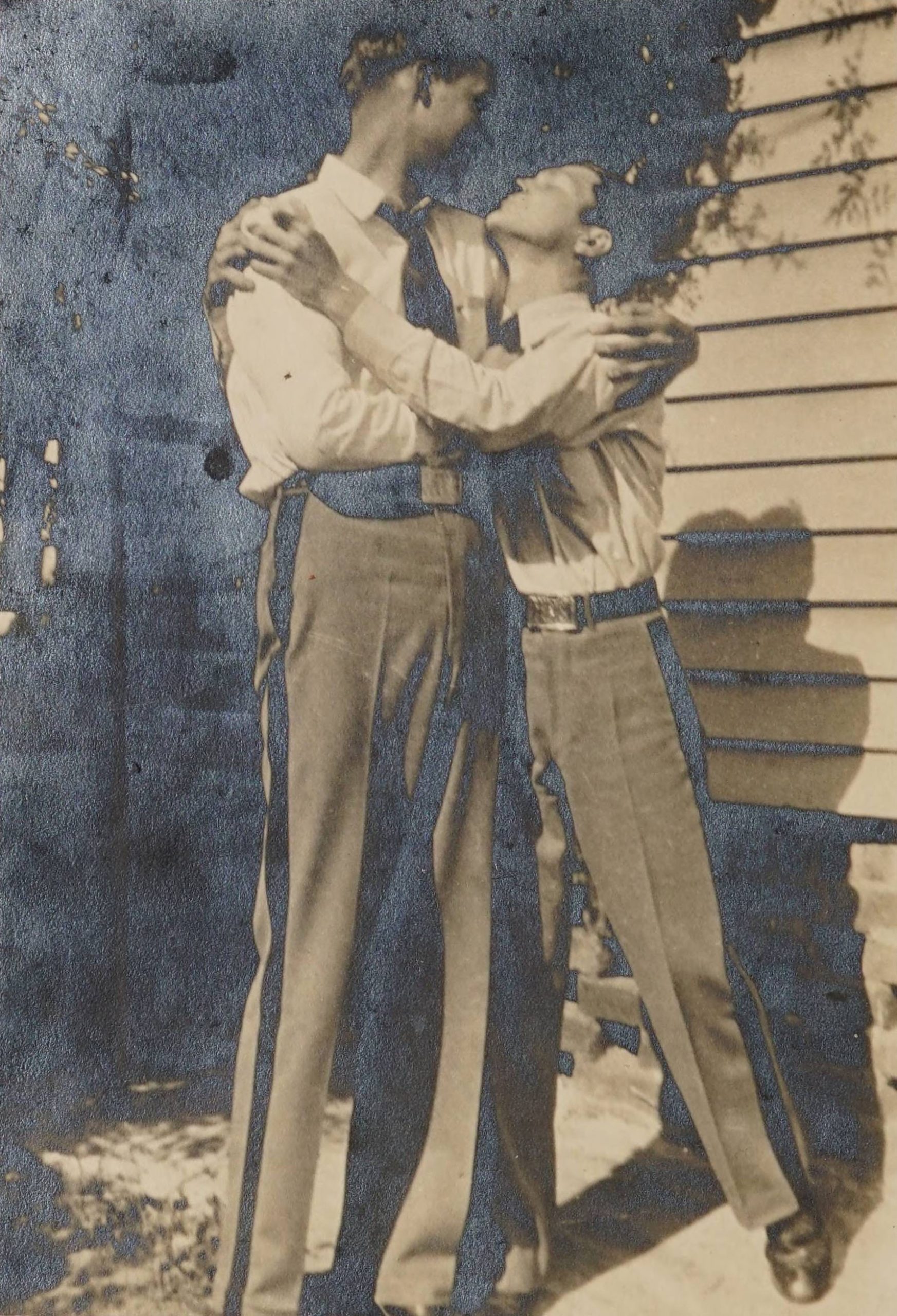 Two individuals embracing one another in a photograph which was taped in the back of the 1932 Mount Pleasant Collegiate Institute yearbook.