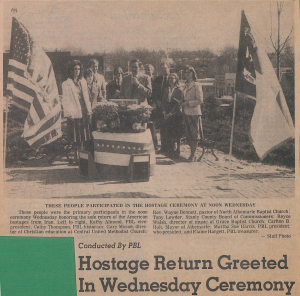 A newspaper clipping from 1981 with a photograph of Stanly Community College students in the Phi Beta Lambda professional organization and Albemarle, N.C., community leaders. They are attending a ceremony celebrating the return of American citizens and diplomats after the Iran Hostage Crisis.