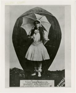 Posed photo of Georgia 'Tiny' Broadwick, 1911. "Youngest Girl Aeronaut"
