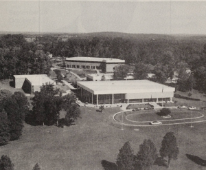 A black-and-white photo of the Stanly Community College campus in 1990. The photo shows a few white buildings clustered together.