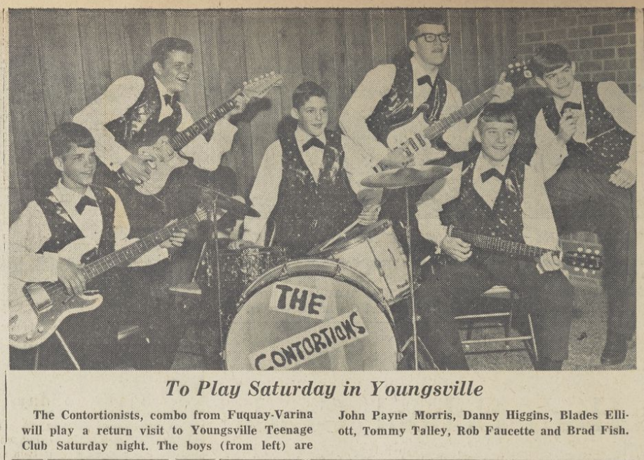 Posed photo of teenage rock band The Contortions with their instruments.