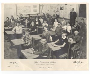 photograph of students sitting at desks in a classroom