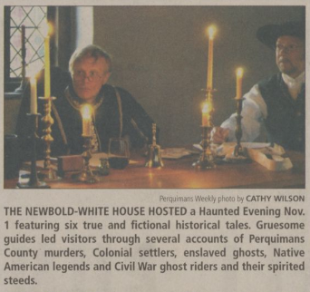 A photo of two men dressed in 18th century outfits lit by candlelight with an accompanying news blurb.