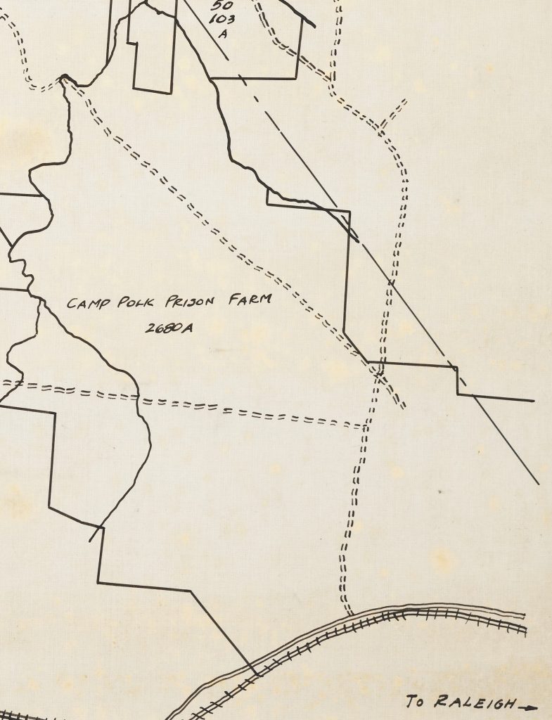 Zoomed in section of a larger map that shows the boundary that encompassed the Camp Polk Prison Farm. In the outlined boundary is written "Camp Polk Prison Farm 2680A." In the bottom right corner is written "To Raleigh" with an arrow pointing to the right.