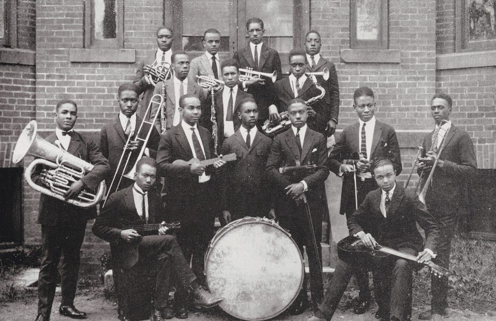 A group of individuals posed for a photograph with their instruments.
