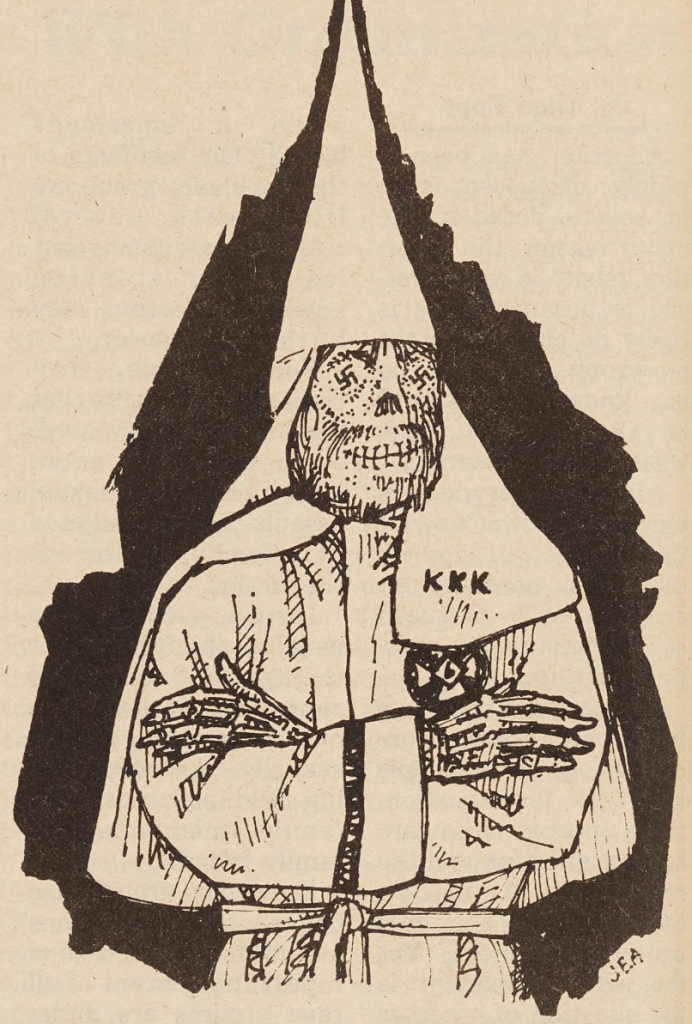 A skeleton dressed up in the KKK robe and hat. Over where the eyes should be are swastika symbols. 