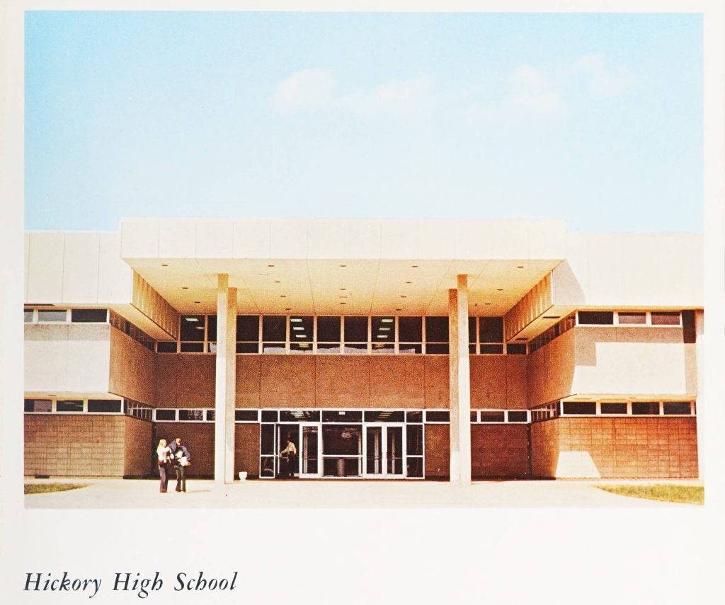 1970s brick style school building. Under the image is written "Hickory High School."
