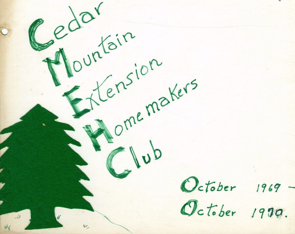 in green lettering "Cedar Mountain Extension Homemakers Club" with a green marker tree next to it