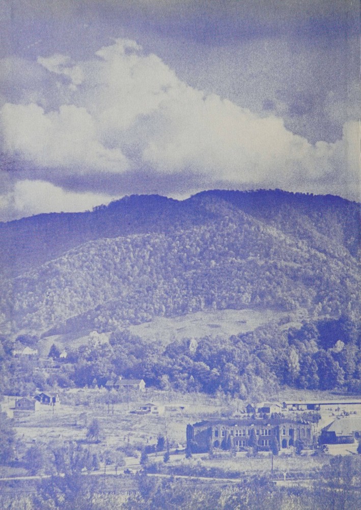 Cyanotype image of Waynesville High School with the mountains in the background