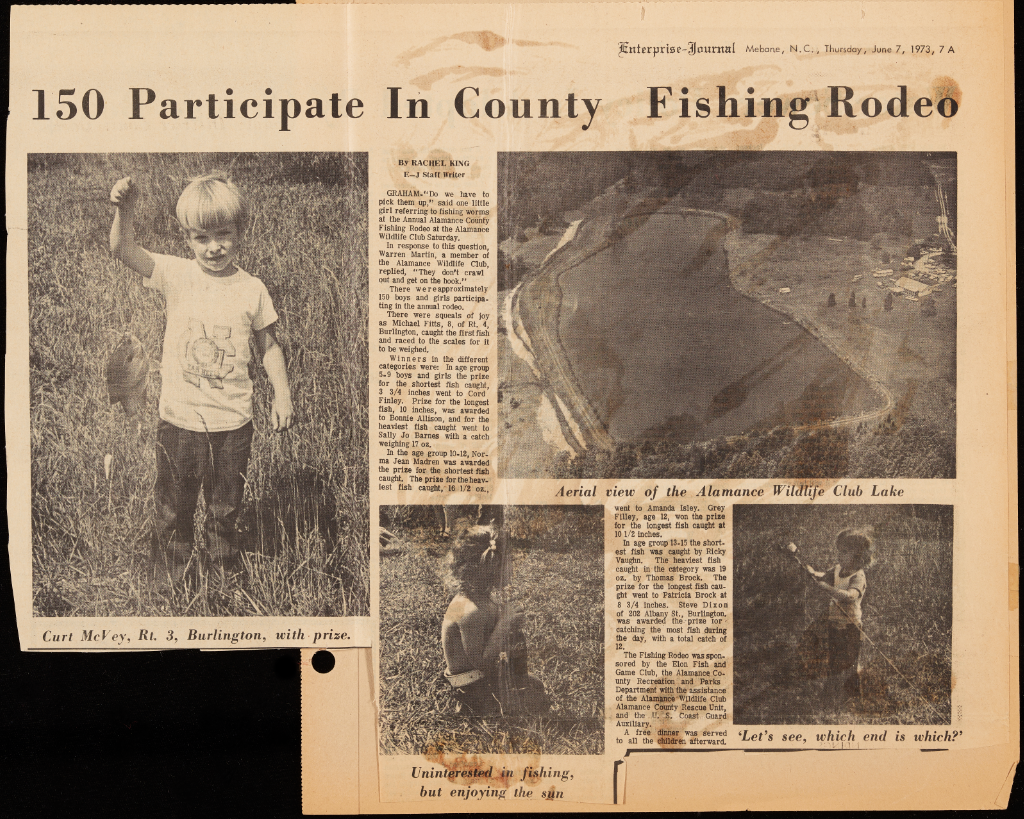 A newspaper clipping featuring the title "150 Participate in County Fishing Rodeo." The page features on aerial photograph of the Alamance Wildlife Club Lake and three photographs of community children posing with a fish they caught, holding a fishing pole, and sitting in the grass.