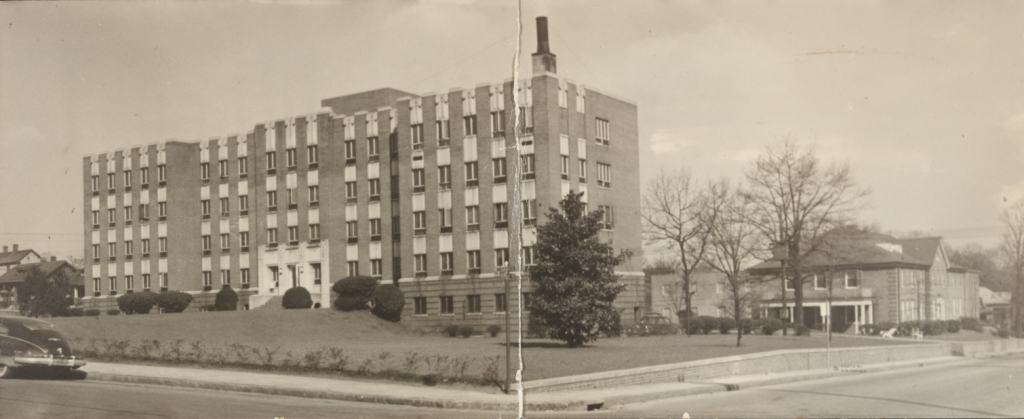 Panoramic photograph of Kate Bitting Reynolds Memorial Hospital (Winston-Salem, N.C.), which served the Black community of Forsyth County from 1938 to 1970. The building pictured to the right of Kate Bitting Memorial Hospital is the nurses' home of the medical facility.