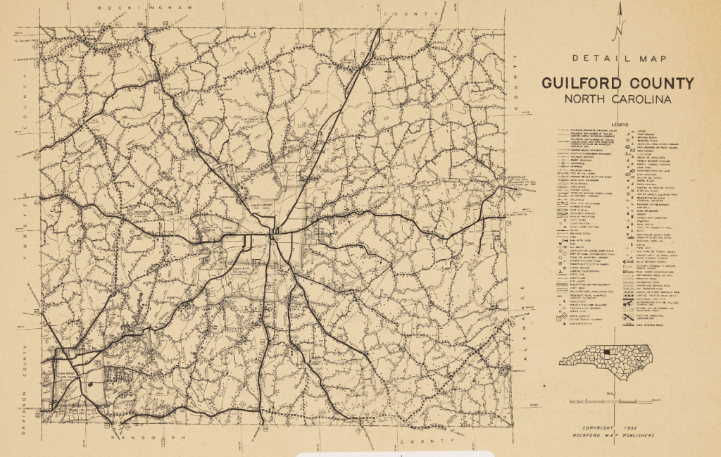 A page of a book featuring a black-and-white map of Guilford County. The map features major roadways, cities, and landmarks, along with a map legend to the right of the page.