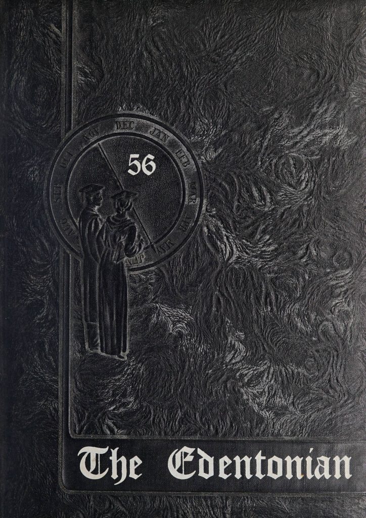 Front cover of the Edentonian [1956]. This black yearbook cover features the title "The Edentonian" prominently featured near the bottom of the cover in a white, decorative script. Two figures wearing graduation attire are embossed in front of an additionally embossed calendar circle.