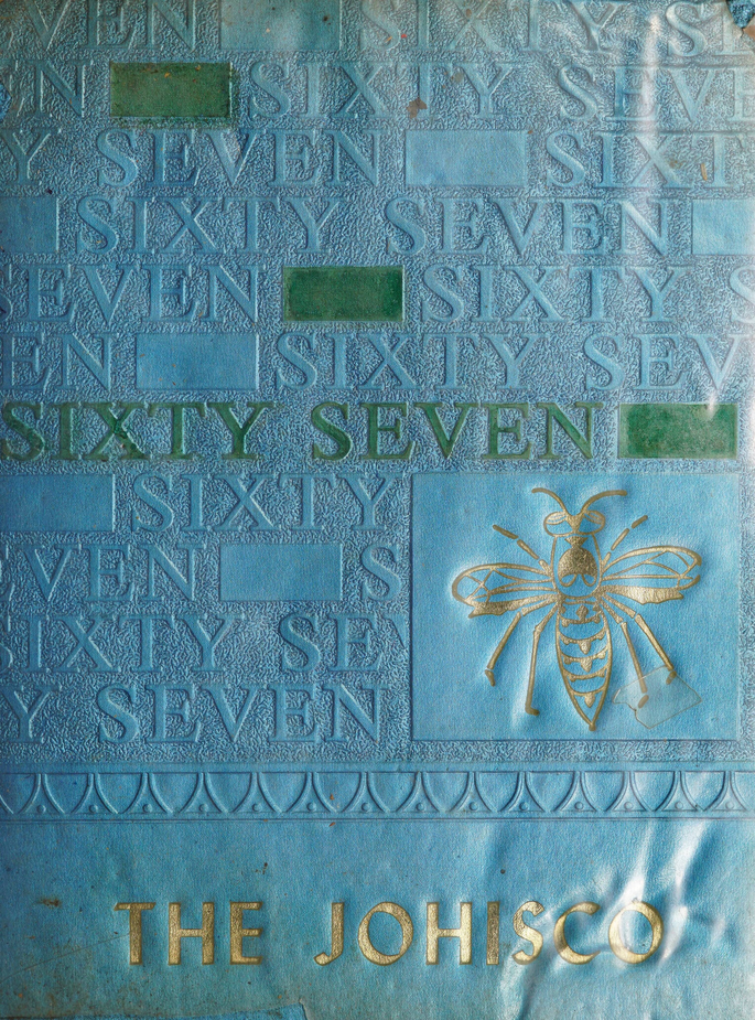 The blue and gold cover of The Johisco, featuring a drawing of a honeybee.