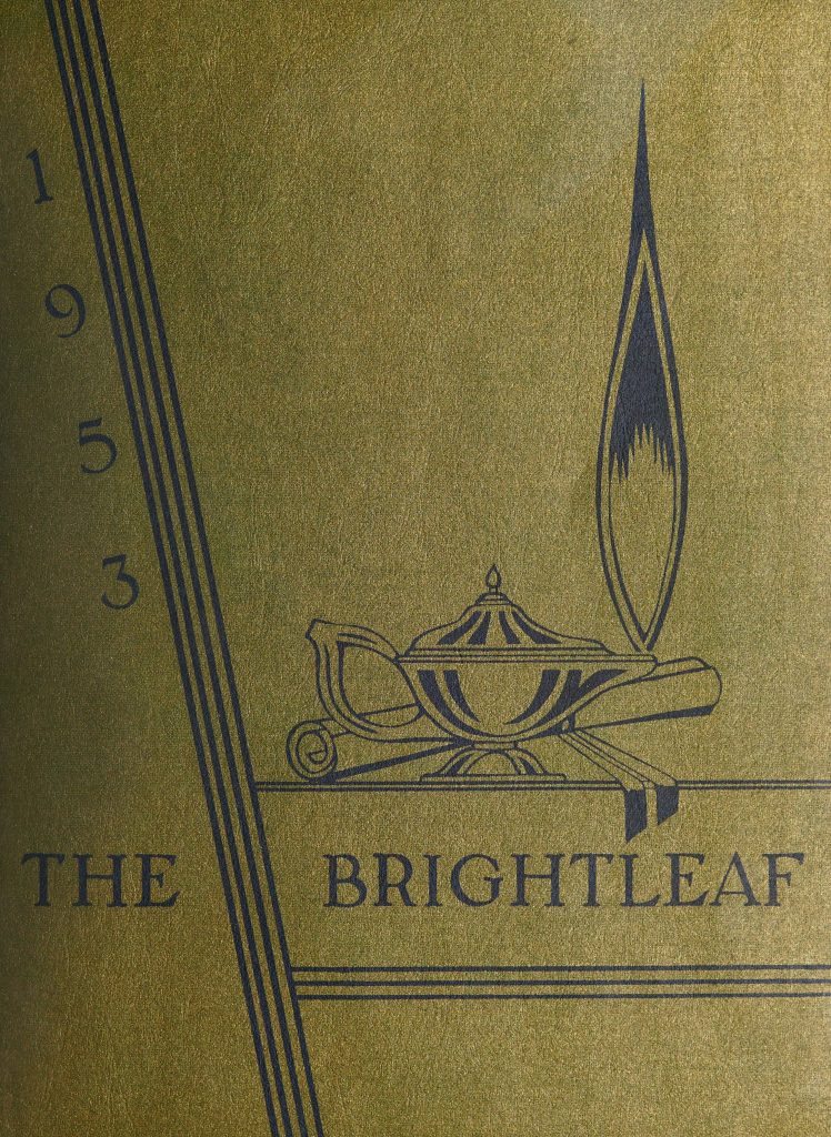 The cover of The Brightleaf [1953], featuring an illustration of an oil lamp and flame next to a rolled diploma scroll in the middle of the golden cover. 
