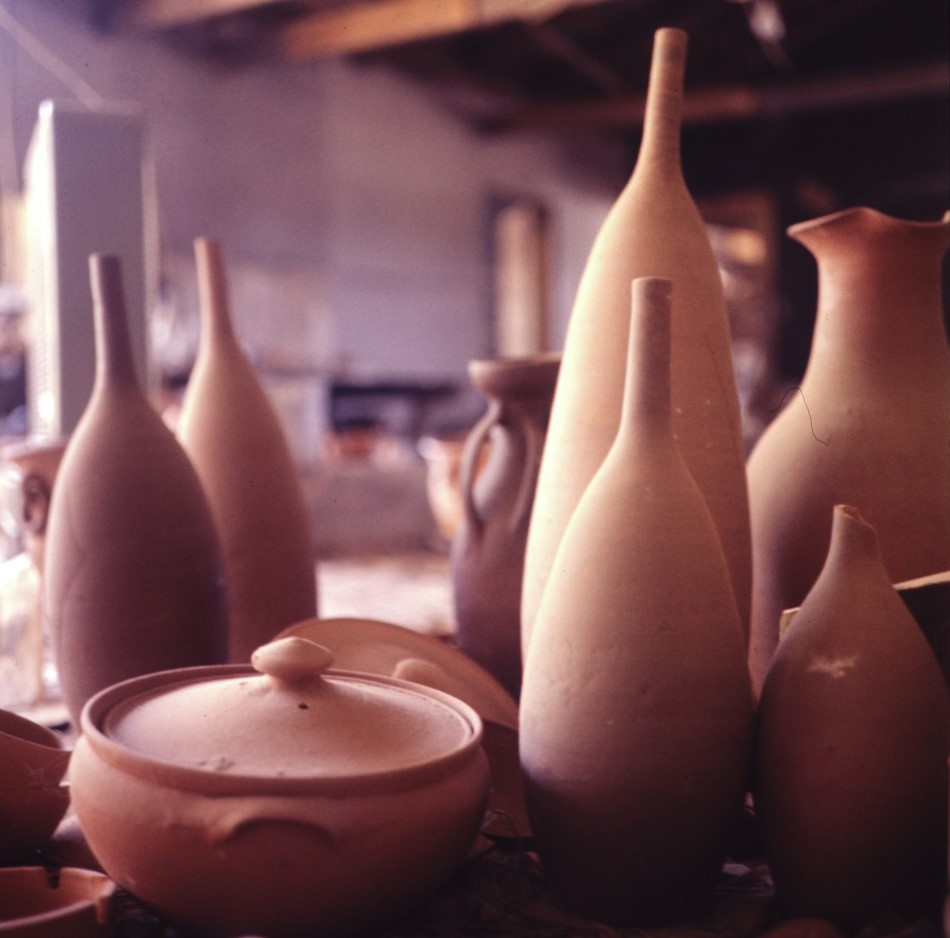 Various pottery wares sitting on top of a table.