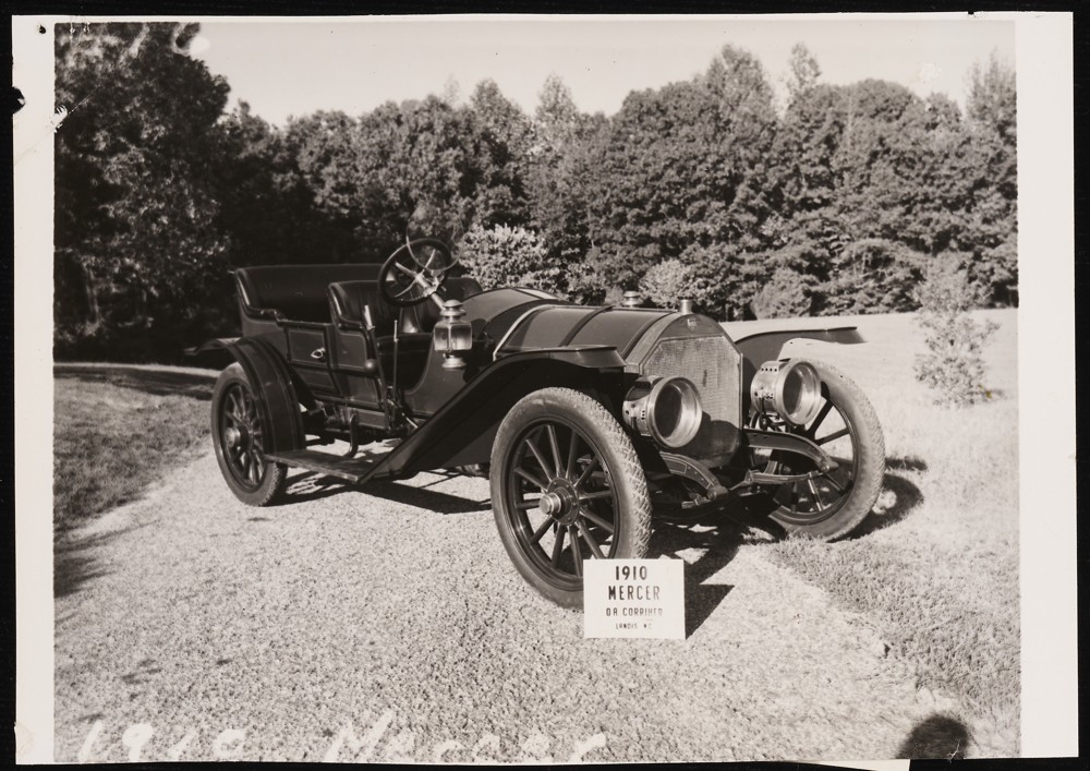 Image of a 1910 Mercer with a sign propped against the front tire that reads: O. A. Corriher. Landis, N.C.