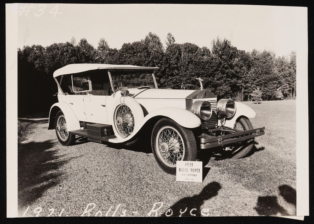 Image of a 1921 Rolls Royce with a sign propped against the front tire that reads: O. A. Corriher. Landis, N.C.